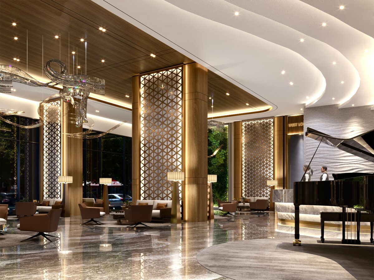 Area lounge Golden Prima Residence dengan piano dan kolom dekoratif